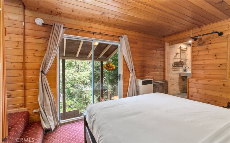 Primary bedroom with its own outdoor access to a covered patio.