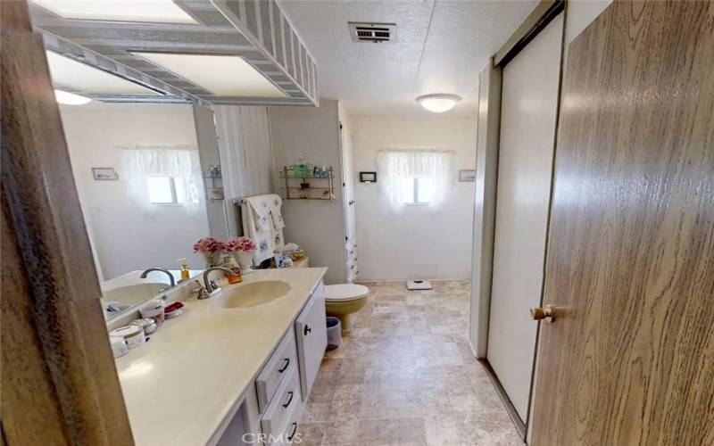 Primary Bath has built-in Makeup Vanity and separate Linen Cabinet