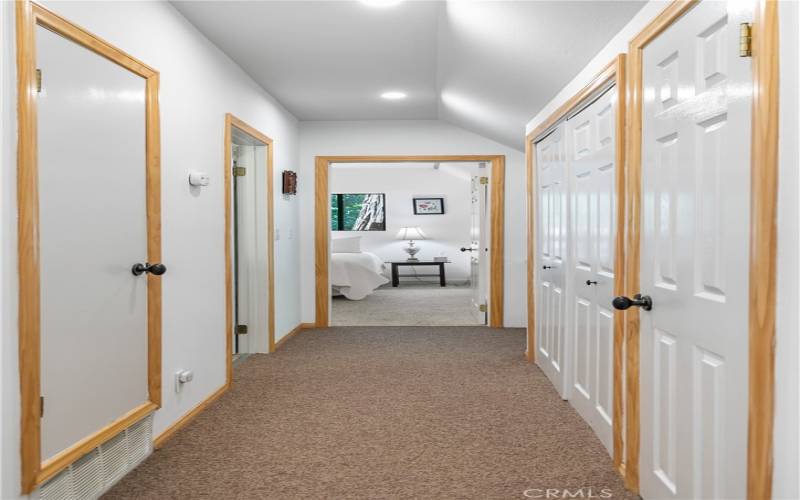 HALLWAY WITH CLOSET AND LAUNDRY CLOSET