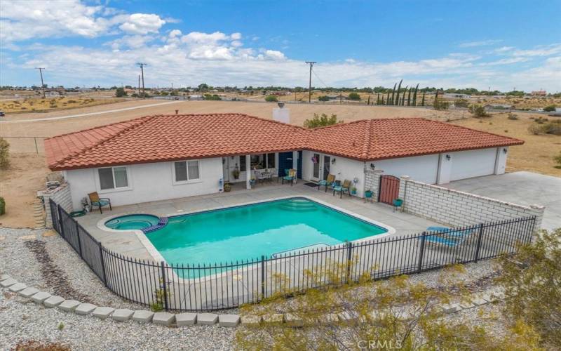 Home 32 -Dry Riverbed surrounding Pool Deck. Block wall provides privacy from the street