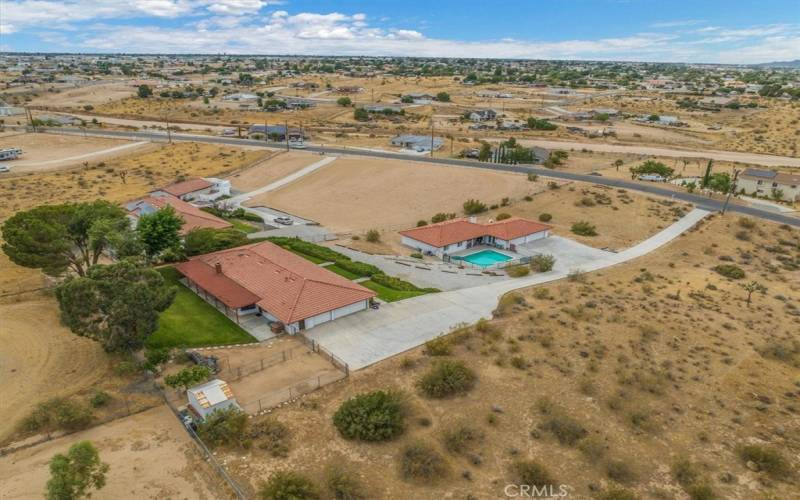 Set back and Elevated from the Street the Long Driveway brings you into your own private family compound.