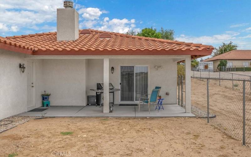 Home #2 - Back Covered Patio with access to the Garage and Slider to the interior Dining Area.