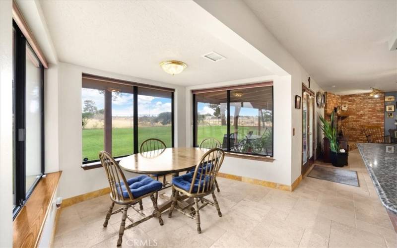 Primary Home - Dining Nook surrounded with windows to take in the Amazing Views!