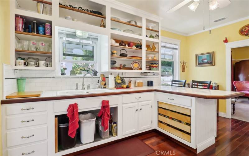 Kitchen hand built by current owner with open shelving concept.