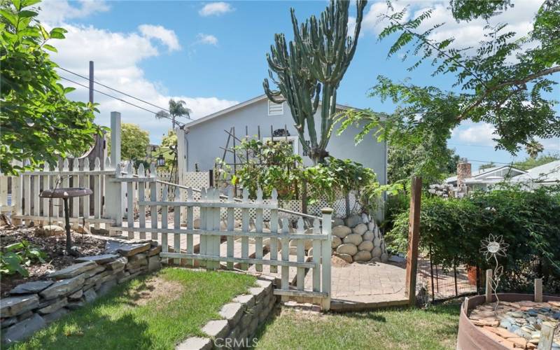 Fenced rear yard with wooden fence