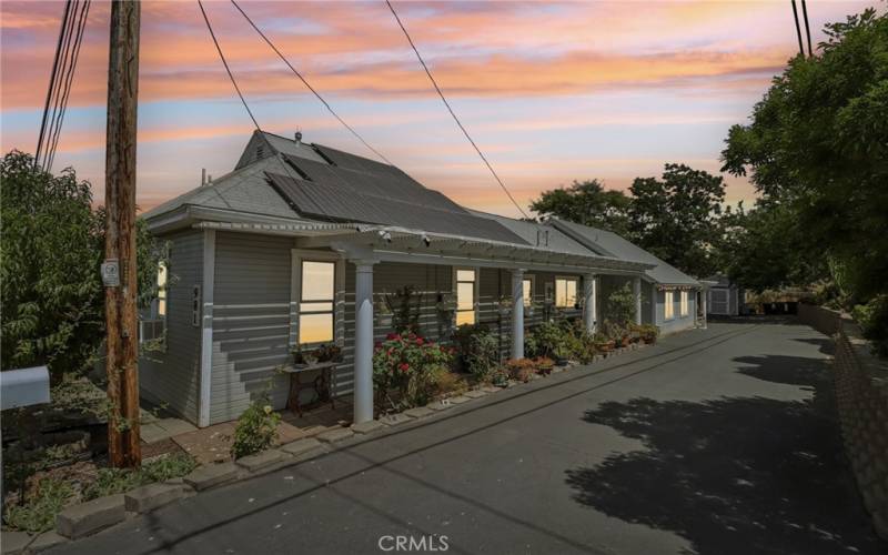 Front Elevation with covered front porch Twilight