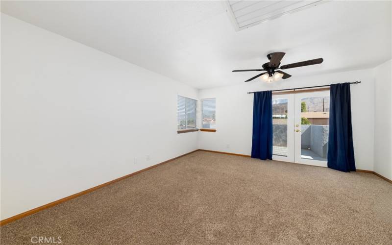 Upstairs Masterbedroom with balcony.