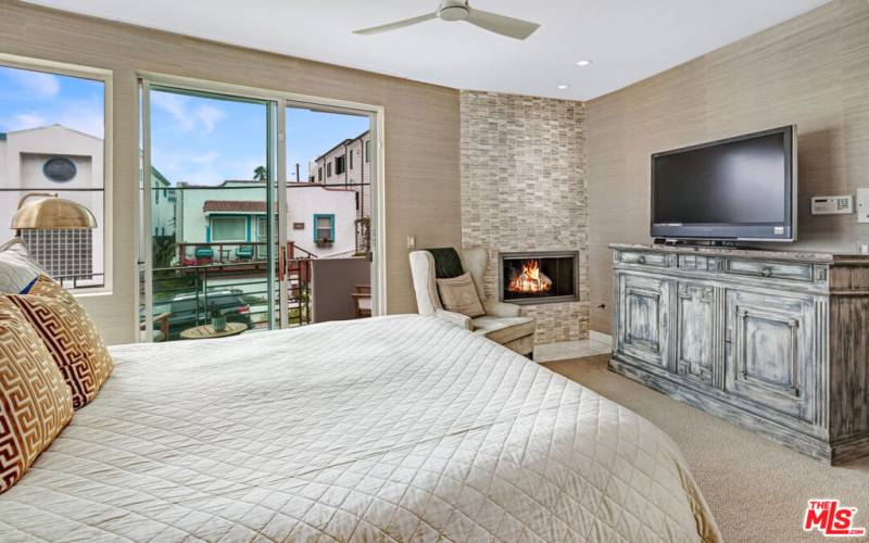 Primary bedroom with patio and sliding glass doors