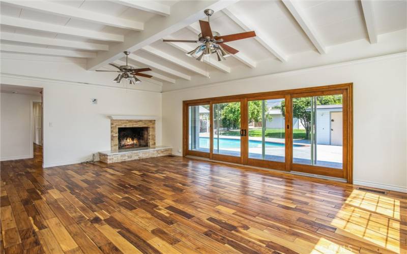 Massive double French Doors lead out to the patio & pool with expansive backyard!