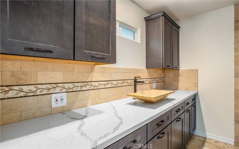 Master Bathroom with stunning quartz and tile surround. Custom cabinetry.