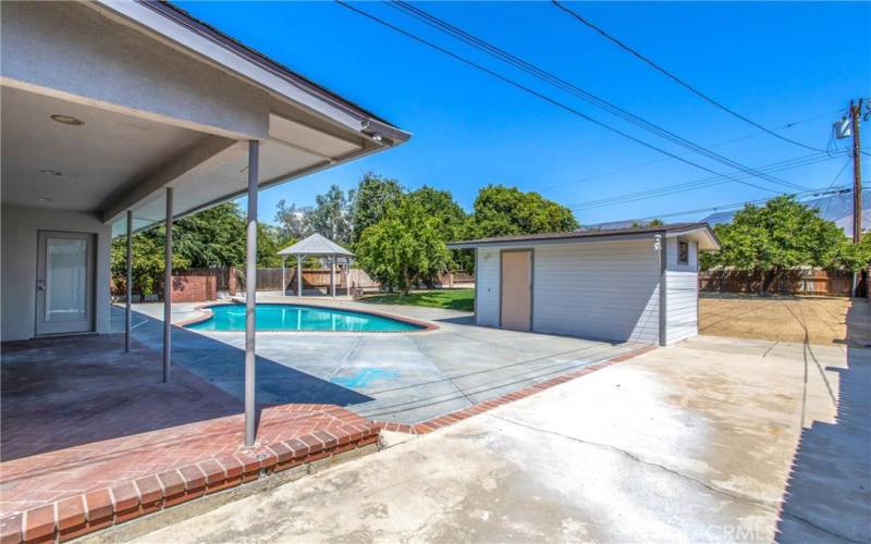 Covered patio area right out the French doors.  Pool house is very convenient!