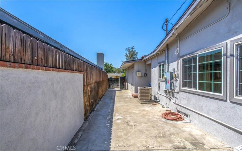 Gated side yard has additional parking driveway in front. May be large enough for a small trailer.