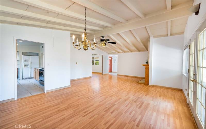 Open floorplan with living and dining room and a tile entry. Dramatic newly painted ceilings!