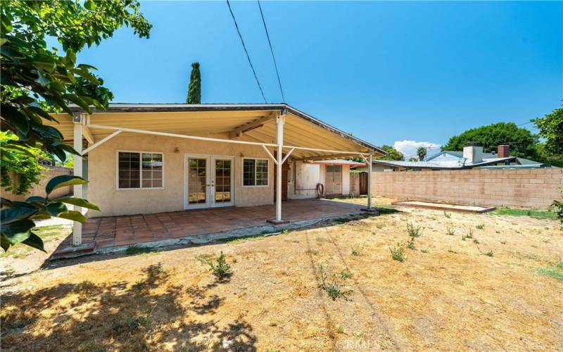 More yard with covered patio