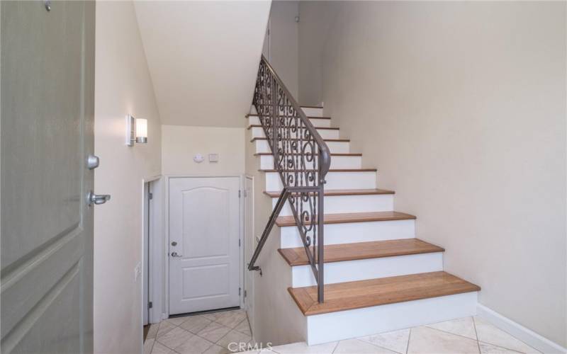 Entry - leads down to a bedroom, bathroom and garage access.