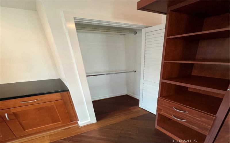 The primary suite has custom built-in cabinets and closet space.