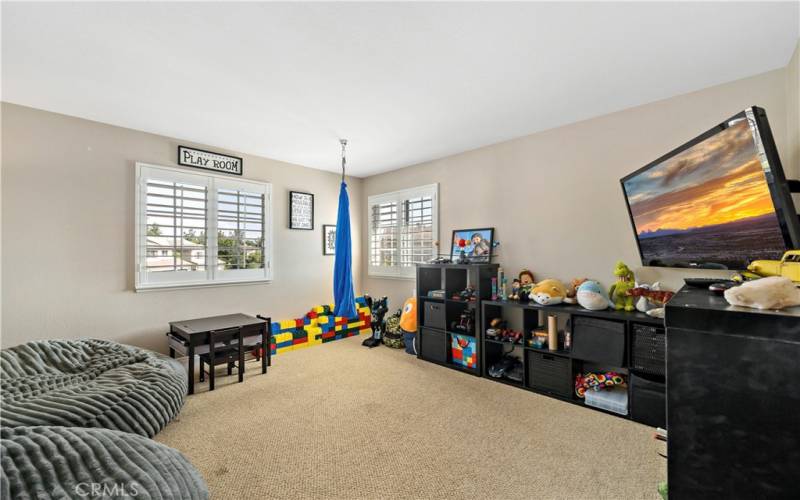 Loft, this enclosed room feels more like a den and could easily be converted into a 5th bedroom.