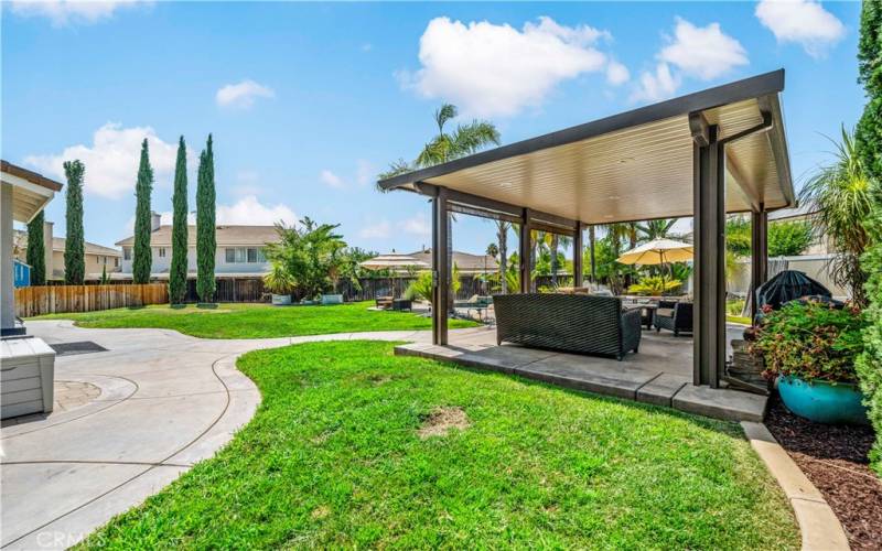 Stand alone patio cover with recessed lights making it an enjoyable space in the evening.