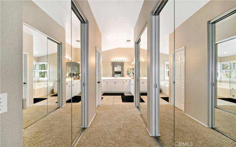 Mirrored doors to walk-in closets.