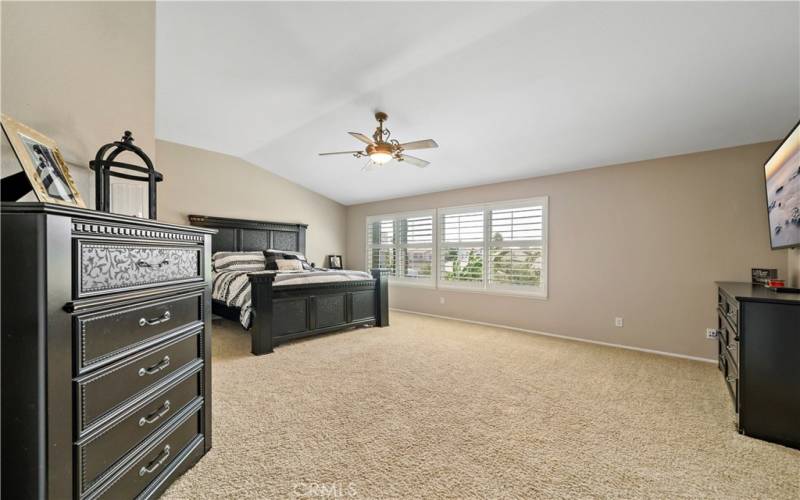 Massive Primary Suite overlooking the backyard and pool.