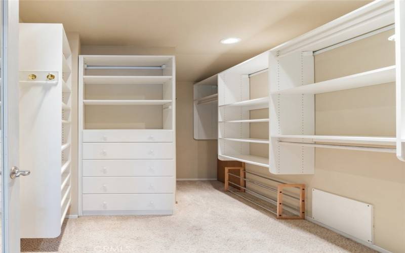 One of two closets in the Primary bedroom.  Pictured is the walk-in closet with California Closet System.