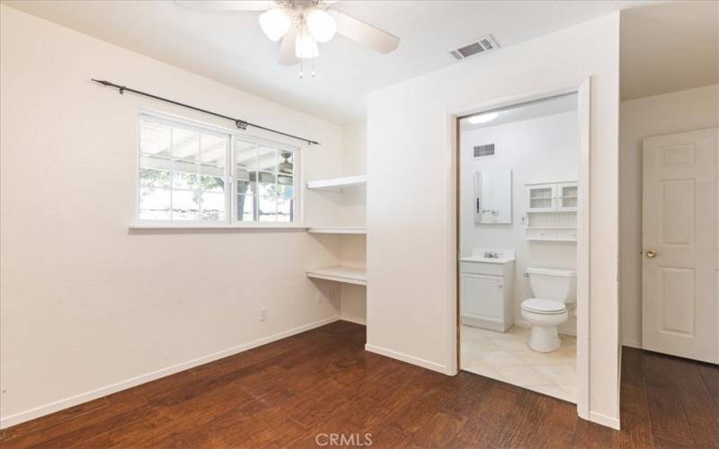 3rd bedroom with bathroom inside.  Showing shelving.