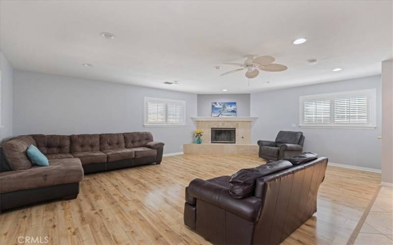 Another view of bonus room showing beautiful fireplace.