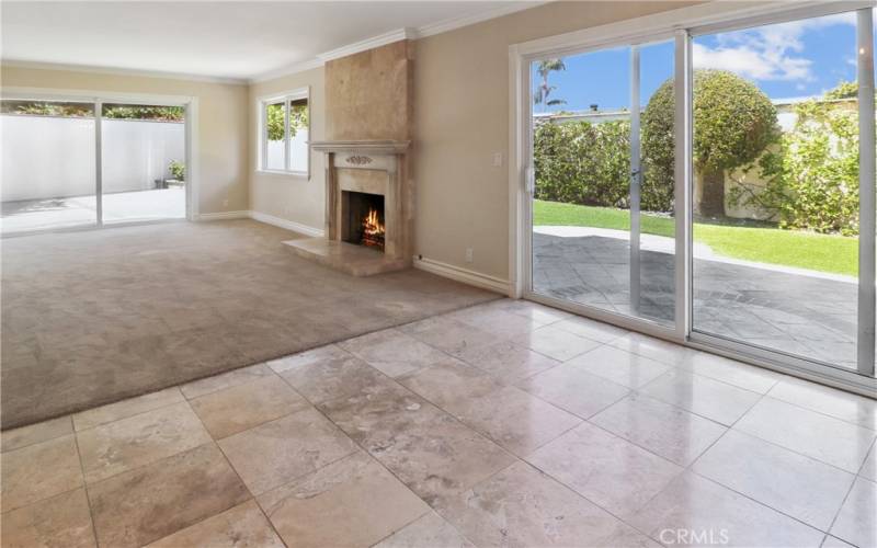 Dining room and living room with fireplace.