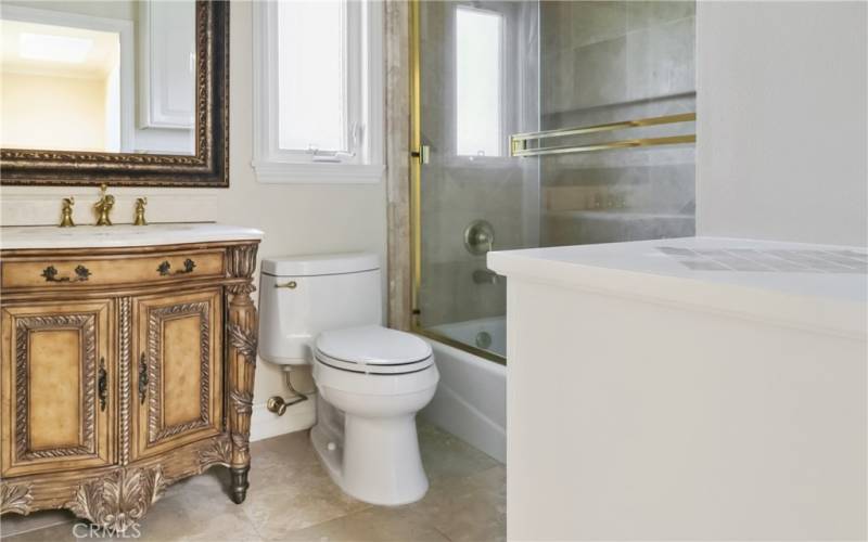 Upstairs bathroom with elegant features.