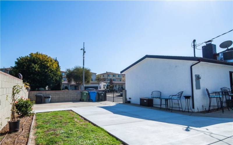 Side yard with Newly laid out cement slab for extra parking