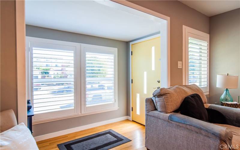 Entry foyer with hardwood floors, Plantation Shutters throughout.