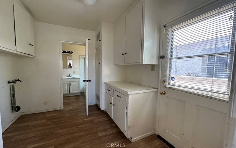 View from kitchen of the Rear entrance to the westside of house.