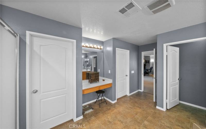 Vanity area and walk-in closets