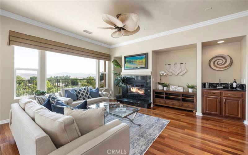 Cozy fireplace and wet bar