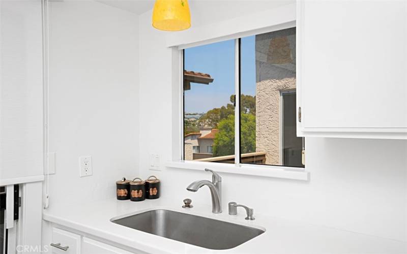 Window in front of Kitchen Sink