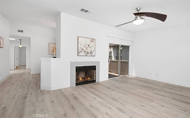 Living Room Fireplace and Balcony Sliding Door