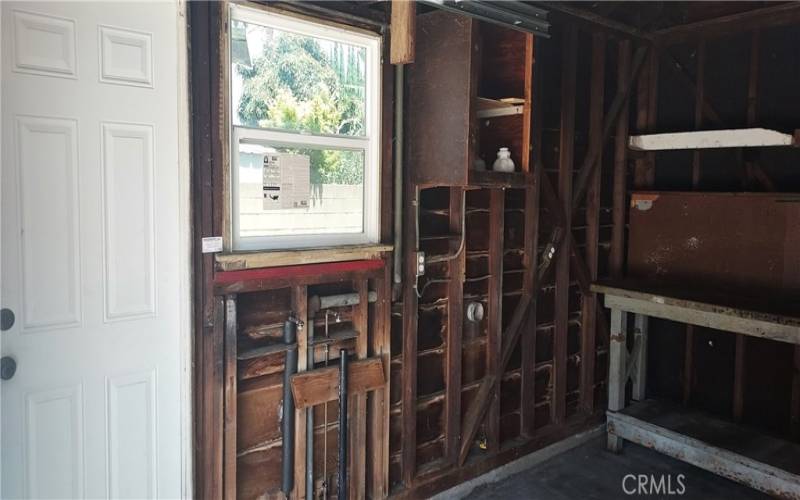 Garage has side door, Laundry, Built in Workbench