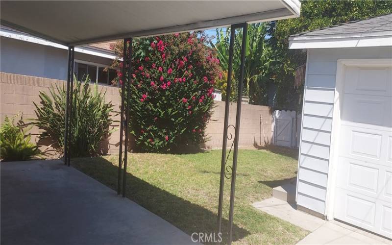 2 Car Garage with roll up door and covered patio