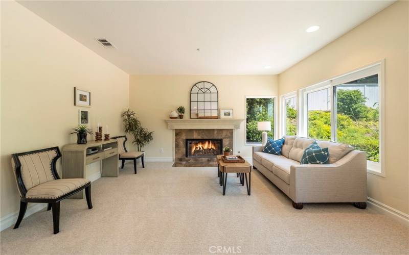 Cozy family room with a fireplace.