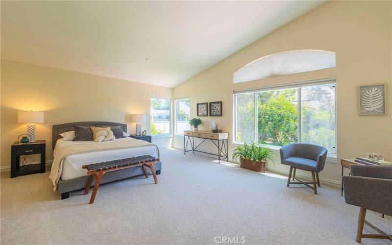 Palatial primary bedroom with retreat area.