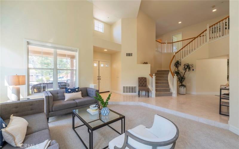 Stately entry with marble floors and beautiful grand staircase.