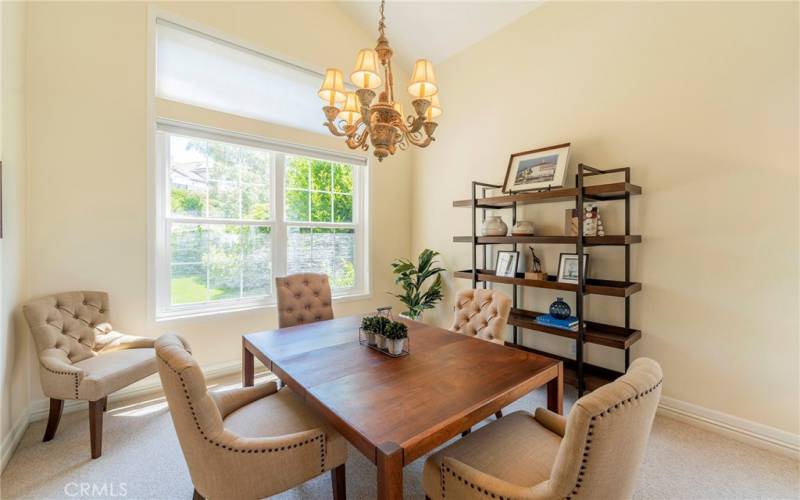 Formal dining room looks out to backyard.