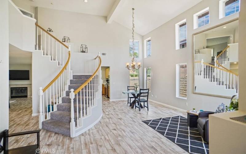 Living room facing dining and kitchen entrance