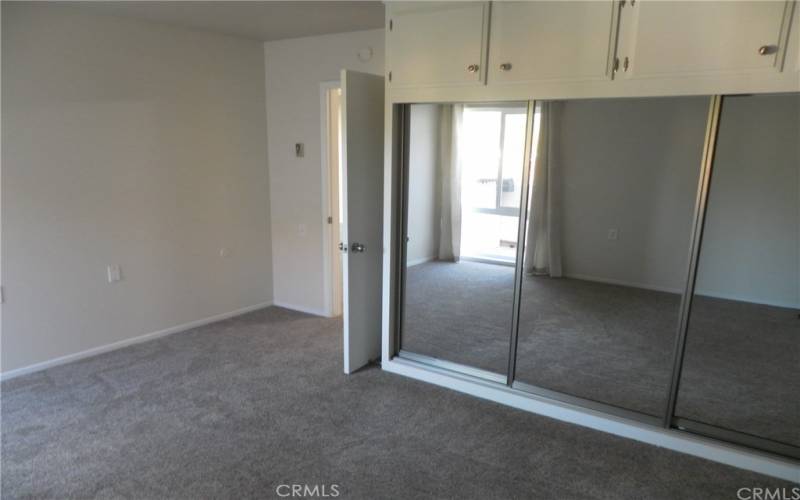 bedroom closet with mirror door