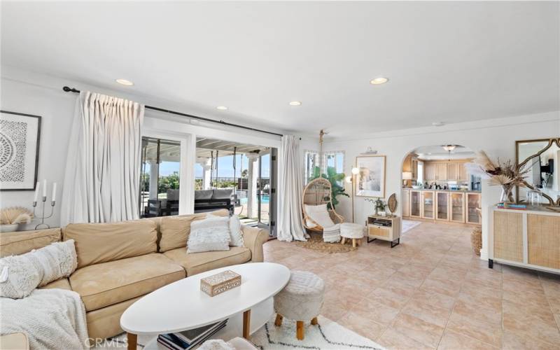 The family room's French doors, large pane windows, and picture window frame mesmerizing ocean views.