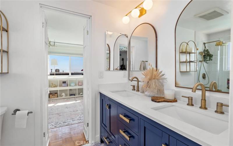 Beautifully remodeled Jack & Jill bath with stunning herringbone tile and a spa-like ambiance.