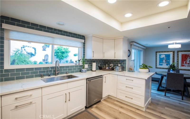 Upgraded kitchen, dining area and slider to beautiful yard.