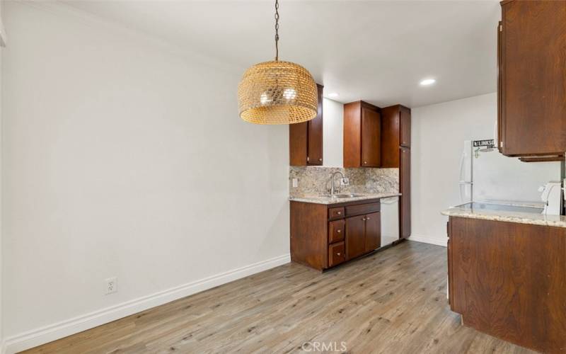 Dining area is located directly off of the sleek and efficient kitchen.