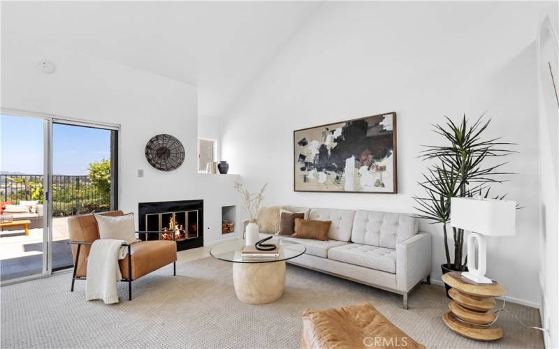 The living room is anchored by a gas fireplace, offering a cozy focal point.