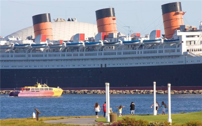 The Queen Mary can be seen from the living room of this unit